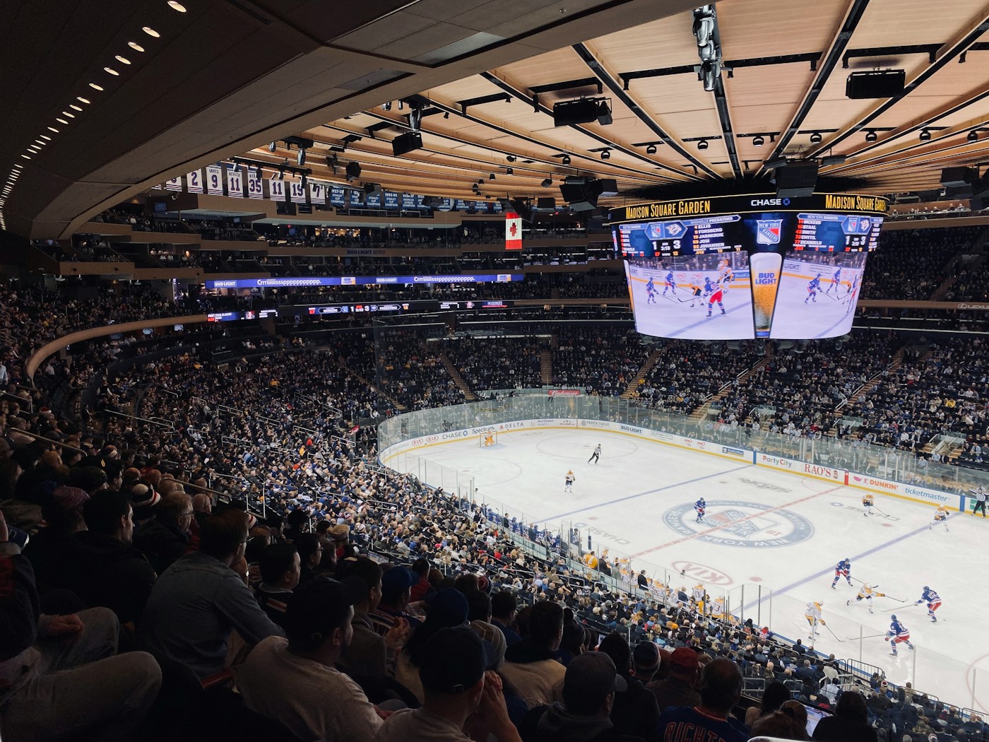 A packed hockey arena during a game